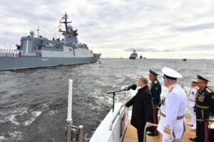 President Vladimir Putin (left) attends the Russia Navy Day parade in St Petersburg, on July 25, 2021.